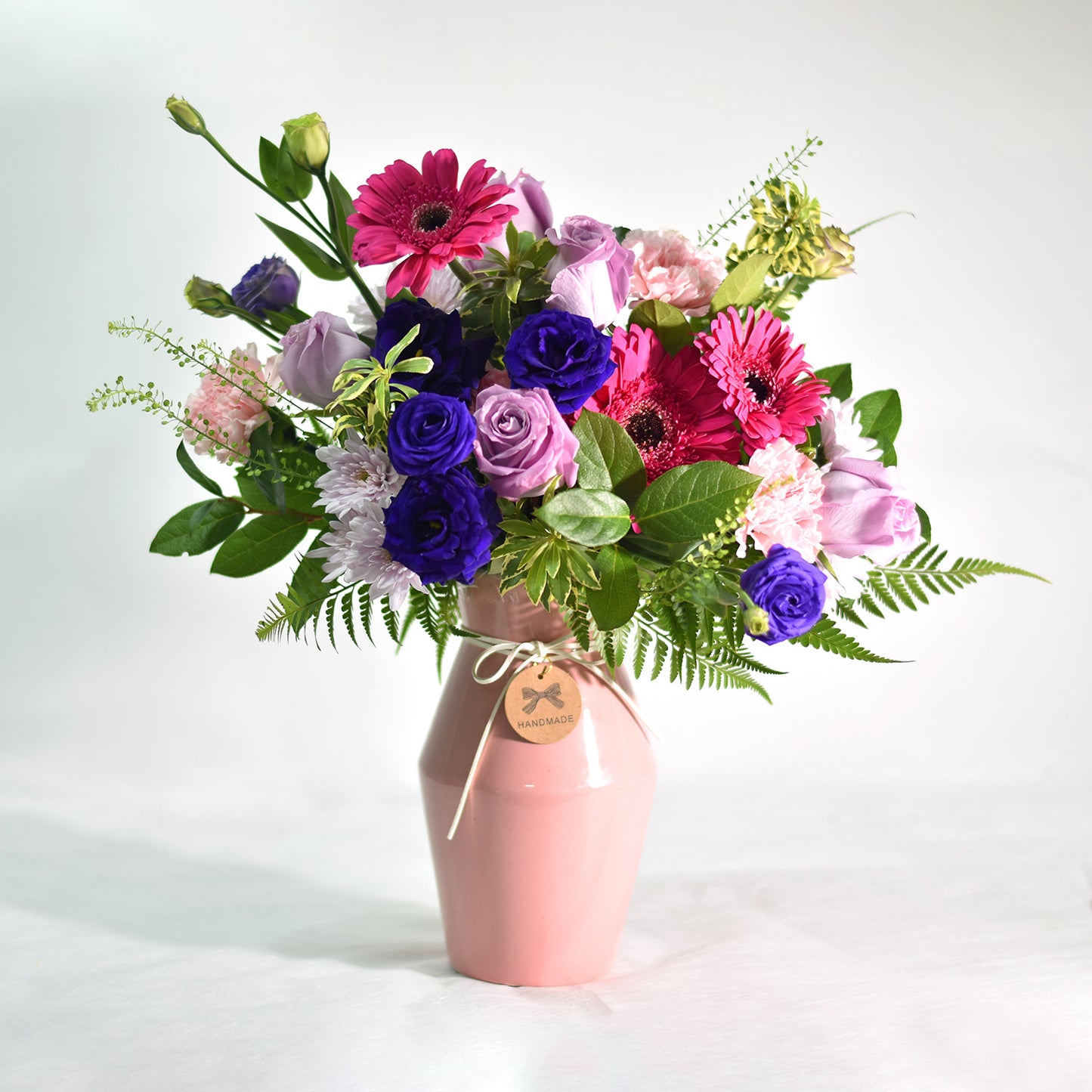 Vibrant Mixed Flowers in Pink Ceramic Vase