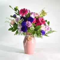 Vibrant Mixed Flowers in Pink Ceramic Vase